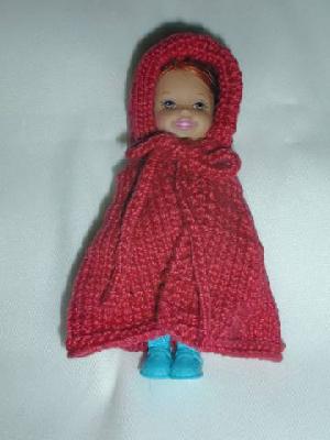 Little Red Riding Hood cape, as worn by my Kelly doll
This is a Little Red Riding Hood cape (pattern by Karen Kolleth, a.k.a. KazKnitz), modeled by my Kelly doll, which I made for my friend's Kelly doll.  My friend dressed up as Little Red Riding Hood for Halloween one year, and I wanted her to have something matching for her 