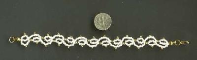 Picot lace bracelet
This is a picot lace bracelet, made to match the picot lace choker.  Yes, the beads are the same color, even though they don't look it.
Keywords: beading