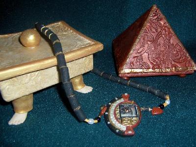 Box, pyramid & necklace
