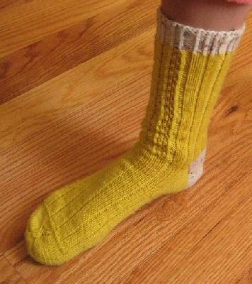 Yellow sock #1
<p>A side view of Katie's sock. I used 2nd color for heels and ribbing in order to make 1 ball of yarn go as far as possible.</p>
Keywords: knit