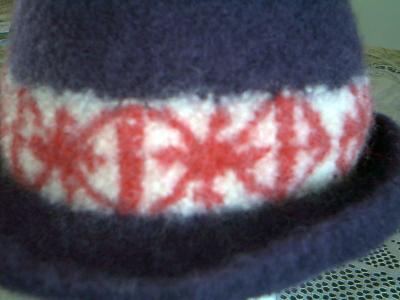 Experiment hats
Here's the experiment.  I did the band and then embroidered the red over the off white band.  I probably should add another view of this one since this is the close up.
Keywords: felted hat