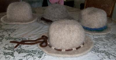 All four again
<p>The brown I-cord is knit into the hat.</p>

