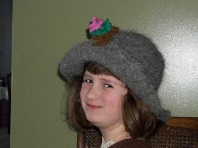 Hat with Cecilia underneath it
