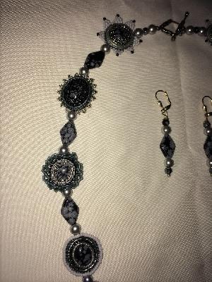 Vulcan High Counsel close up
<p>Note that the necklace part of the piece is finished in snow flake jasper cabochons, each beaded in different styles.</p>
