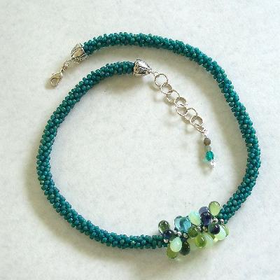 Teal Green Kumihimo Necklace with Glass Drops
<p>This necklace is teal green seed beads with a center focal of glass drops in mixed greens.</p>
Keywords: kumihimo teal green drops